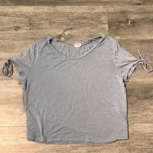 Periwinkle blue cropped top with tied sleeves